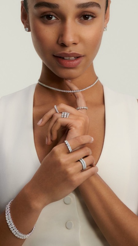 Model wearing a Ryan Jewelers diamond tennis necklace and rings